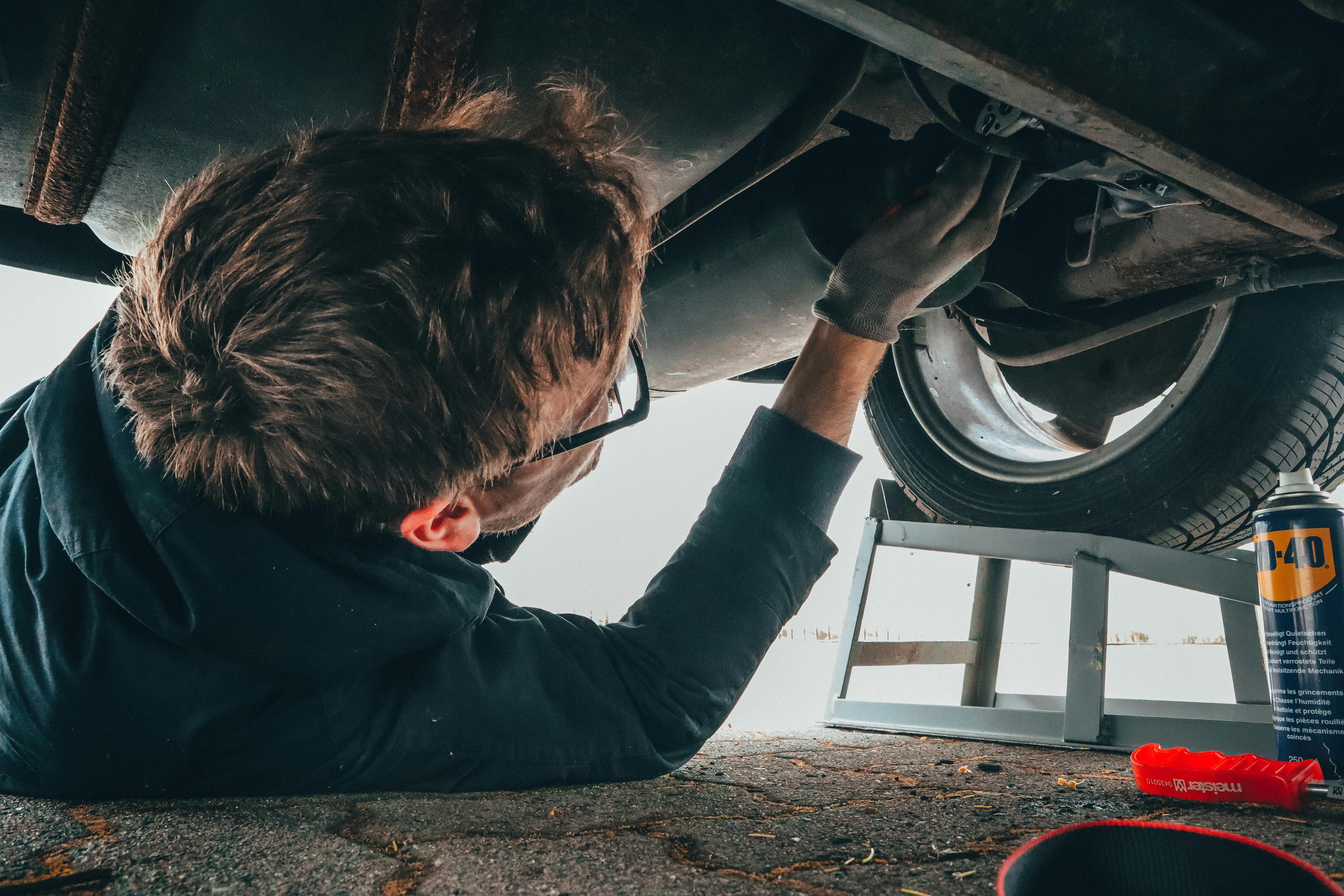 Mechanic performing vehicle service